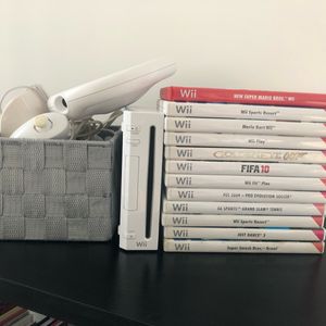 Wii avec 12 jeux + board Wii Fit 