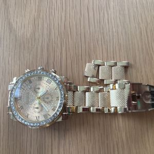 Montre dorée pile à changer 
