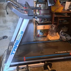 Tapis de course en bon état de fonctionnement