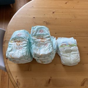 21 couches Pampers taille 4/5