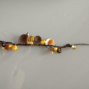 Bracelet fantaisie tons orangé/marron 