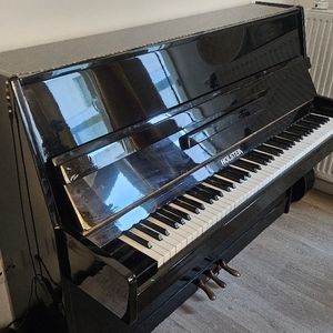 Joli piano droit noir bois laqué