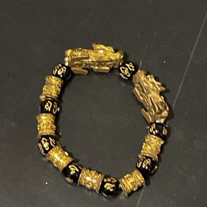 Gros bracelet doré et noir