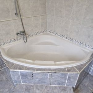 Baignoire d'angle 140x140 en fibre